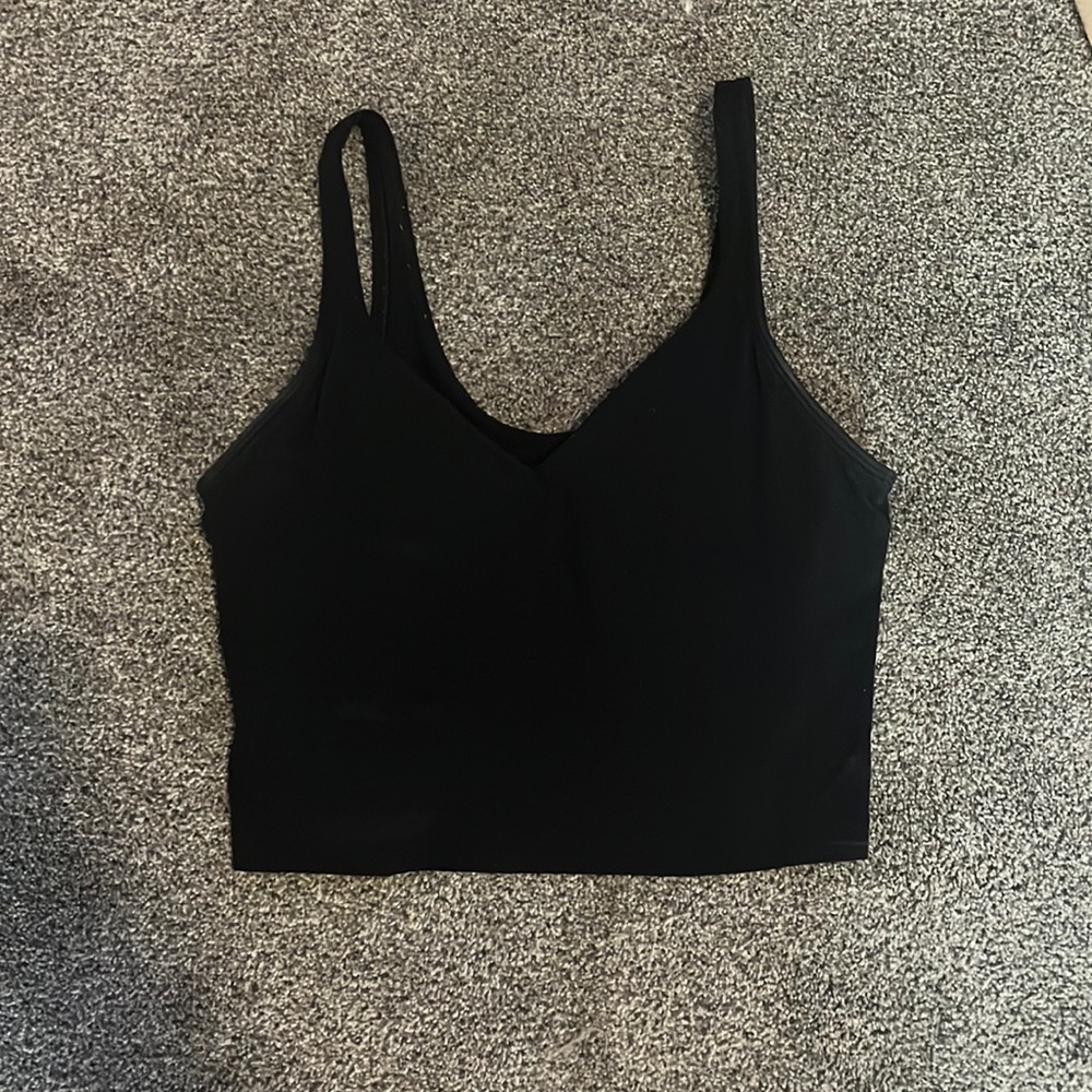 Black lululemon croptop. It’s not that cropped.The size is either 3 or a 4